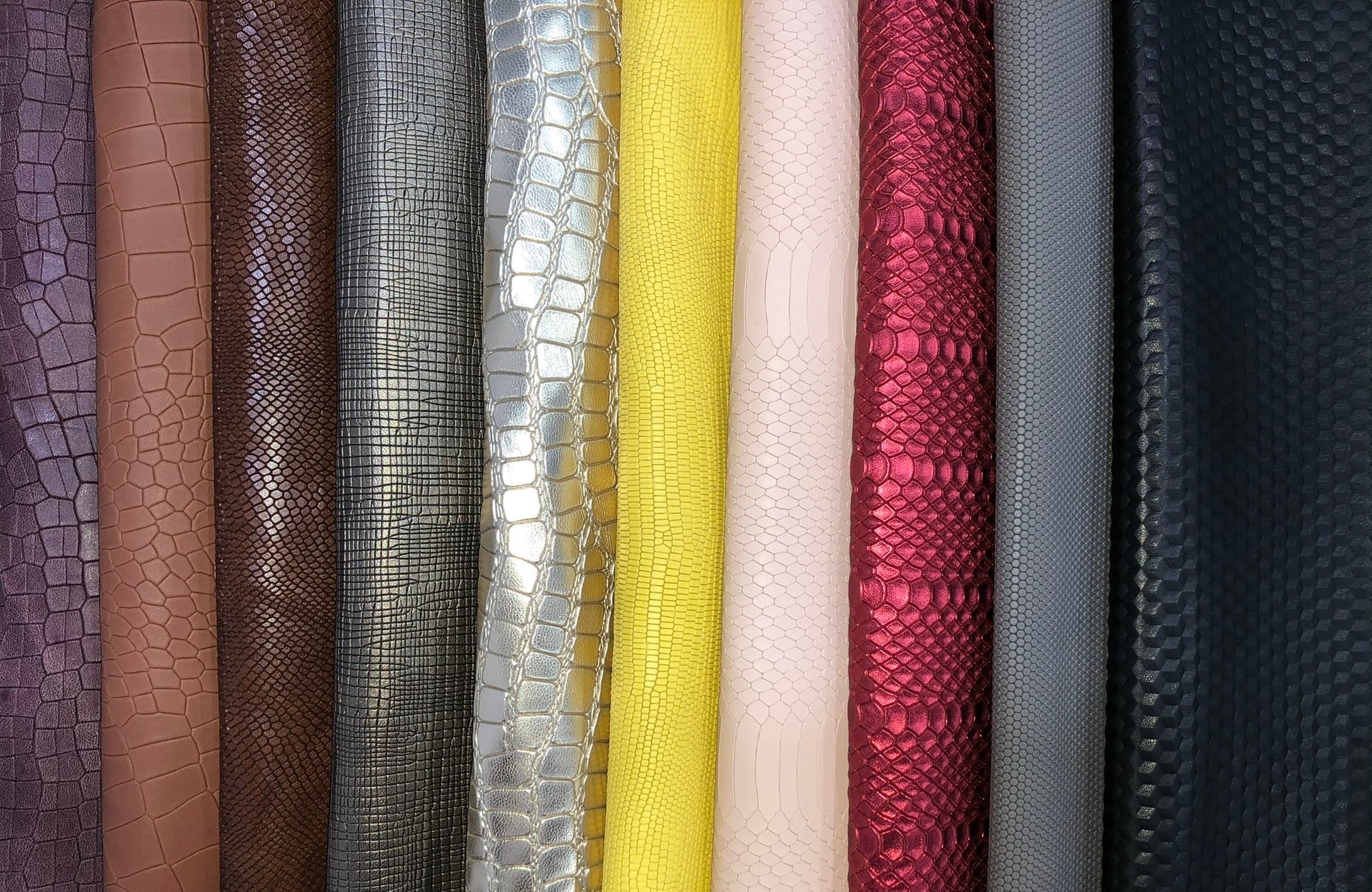 Leather article samples arranged in a grid.