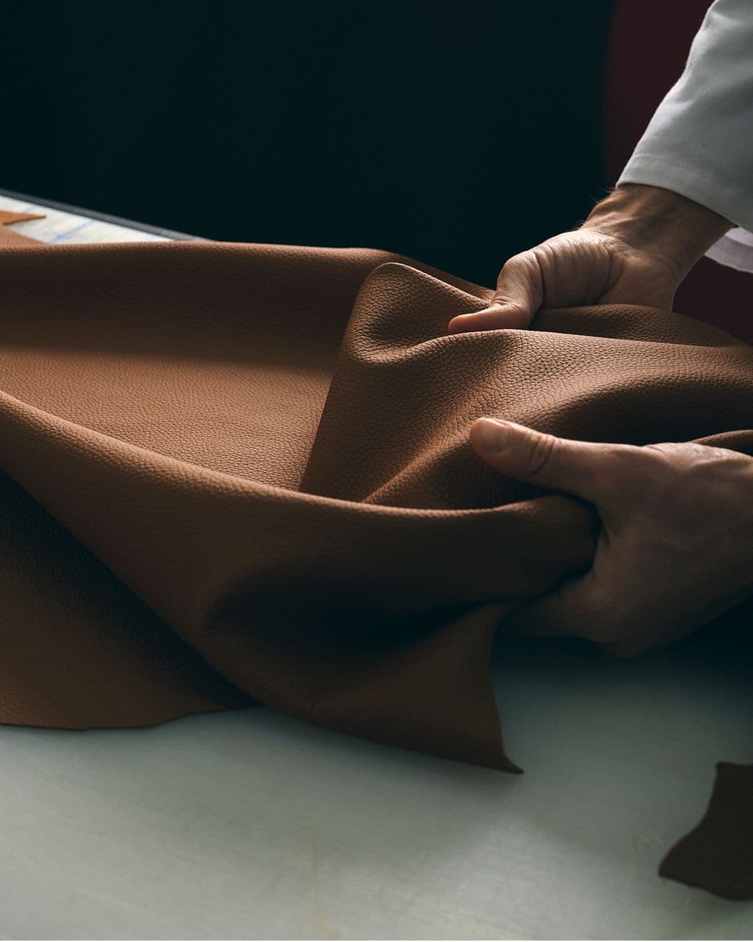 Leather hand-feel inspection.